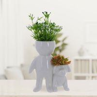 Planta-Artificial-Con-Maceta-Muñequito-Con-Perrito-Blanco-12.9-X-9-X-21-Cm---Concepts